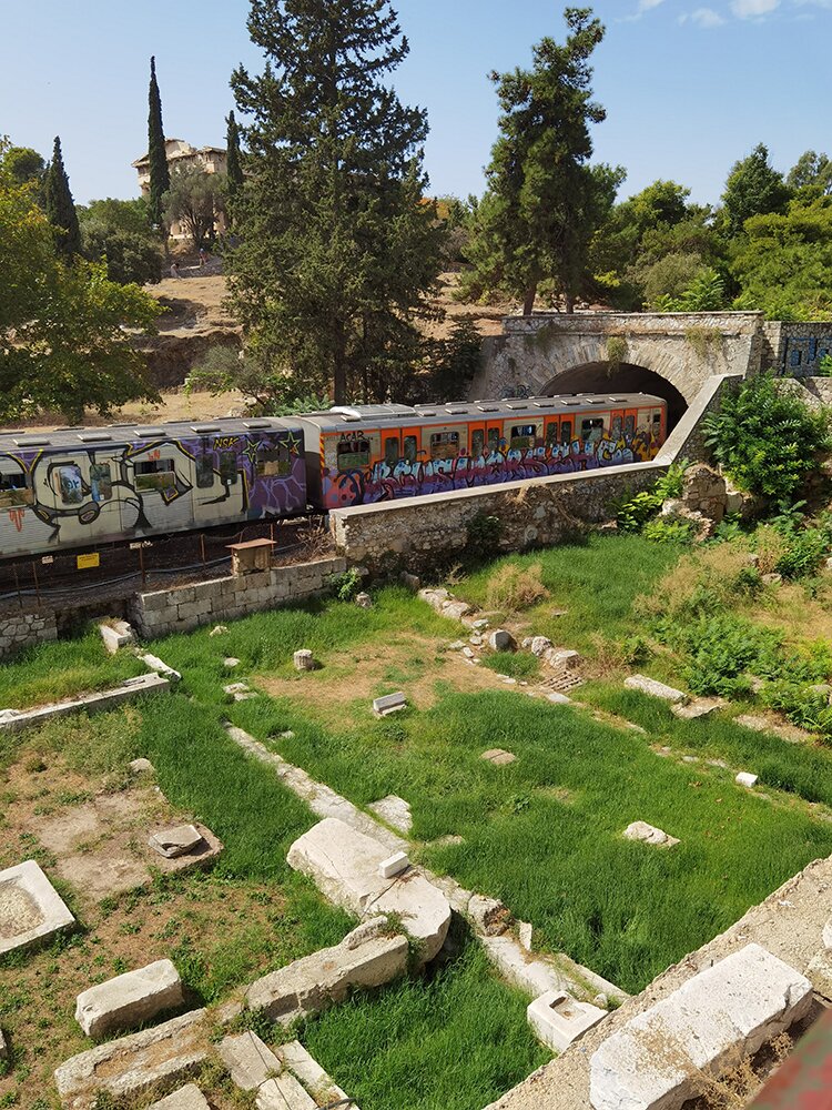 The electric train as it passes the Ancient Agora and the Temple of Hephaestus